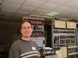 Andrew next to a working reconstruction of the Colossus machine, used to help decrypt Hitler's special codes.