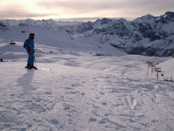 A skier ponders where to head to next. Or maybe the views have proved too much of a distraction.