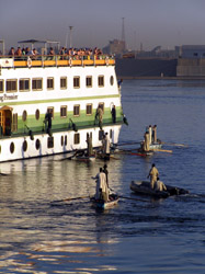 Local merchants make the most of tourists waiting to go through the lock between Luxor and Aswan. 