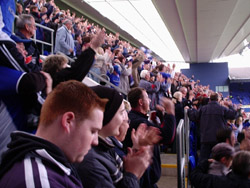 The crowd goes wild as an Ipswich goal ties the scores (the red-head in the foreground intently records the cheers!)