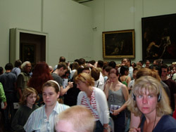 The Mona Lisa mosh-pit at the Louvre Museum. The painting is on the left.